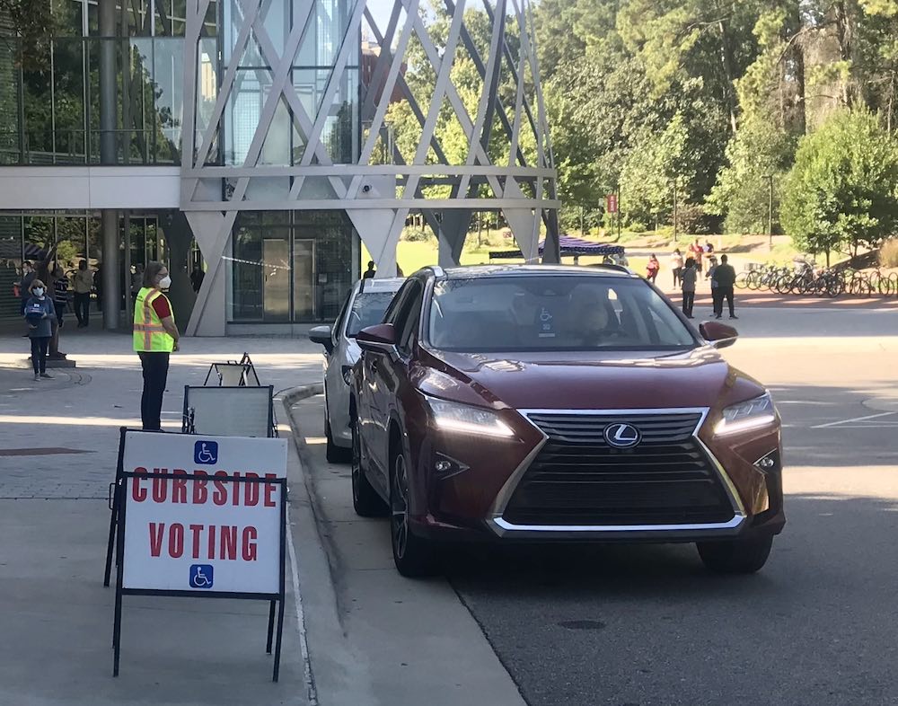 SUV waiting at curbside voting