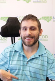 image of Bryan Dooley sitting in wheelchair