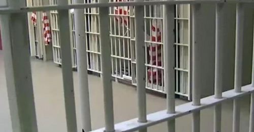 photo view form behind cell bars