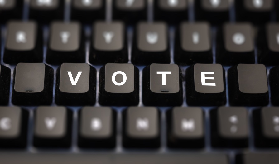 computer keyboard with the word "vote" highlighted in the center keys