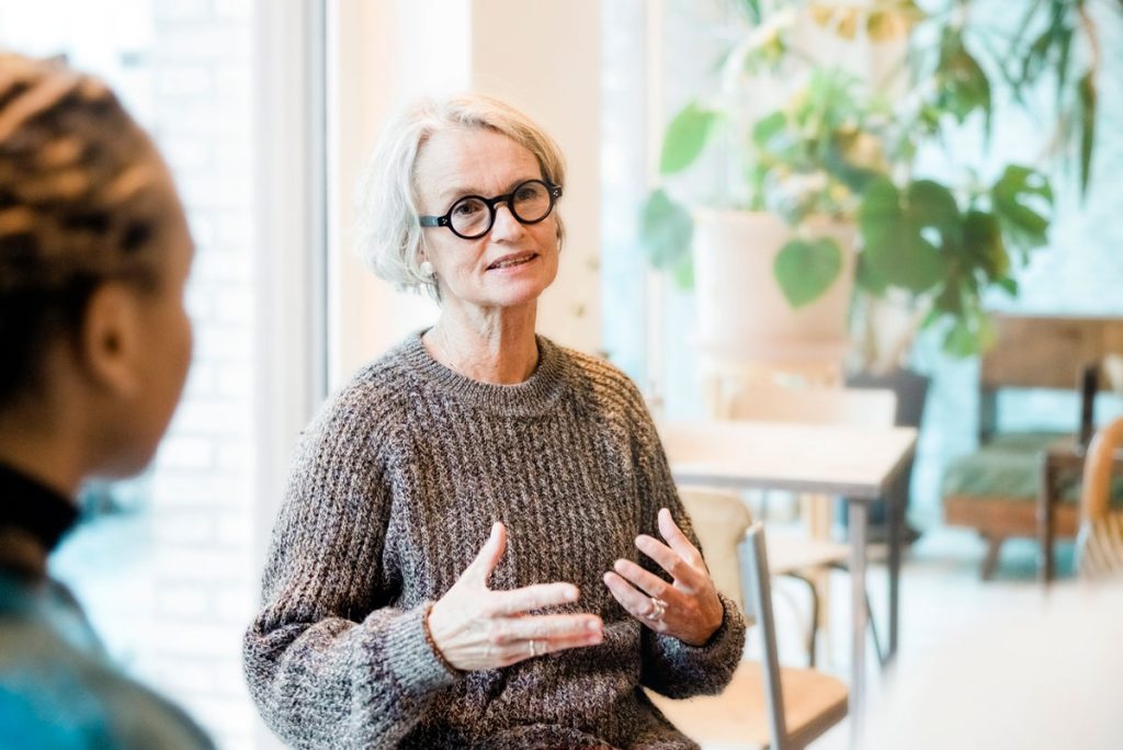 Senior woman talking about medicaid