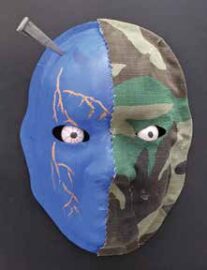 Blue and army camo mask with nail in upper left corner