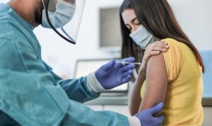 Women gets vaccinated at a clinic