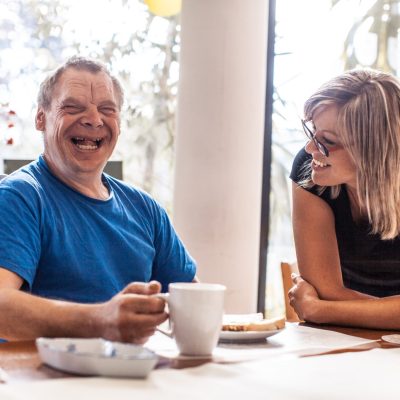 woman provides community based services to man with down syndrome