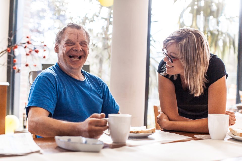 woman provides community based services to man with down syndrome