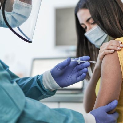 Women gets vaccinated at a clinic