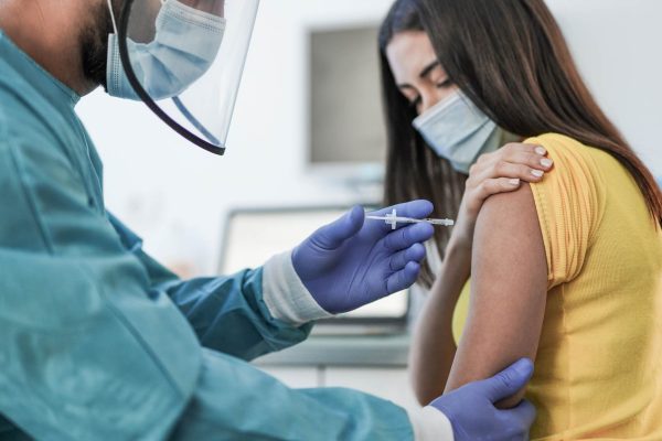 Women gets vaccinated at a clinic