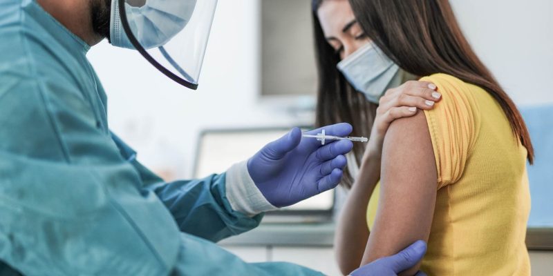 Women gets vaccinated at a clinic