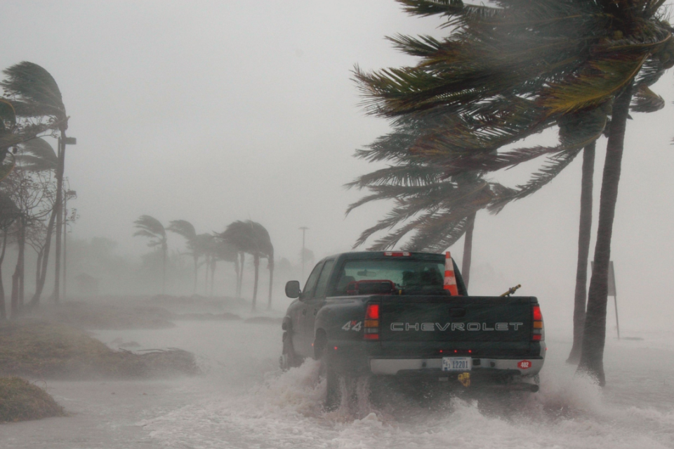 Truck driving through water in hurricane