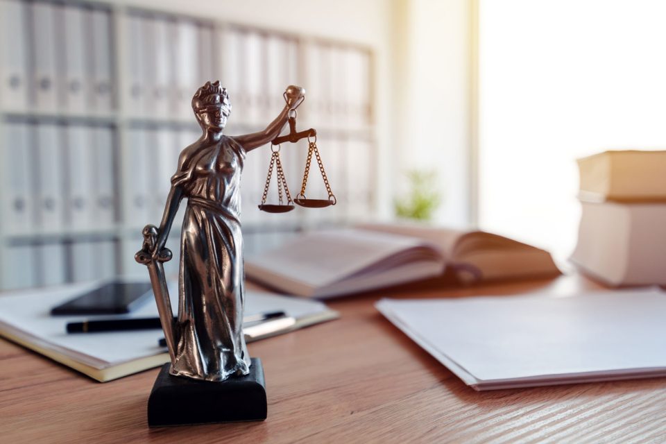 Lady justice on a desk in a law office