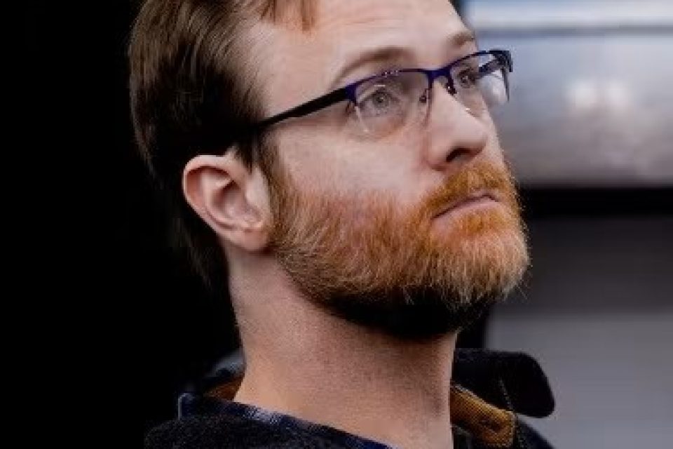 headshot of Lee James