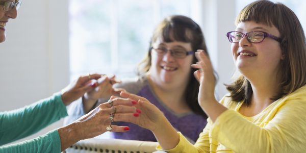 Mother and two daughters with down syndrome