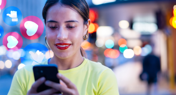 woman on phone in busy evening cityscape.