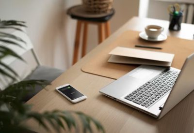 Home desk with laptop and notebooks