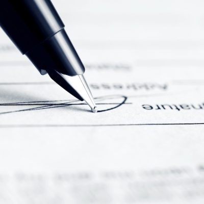 pen placed on signature line, signing a letter requesting workplace accommodations