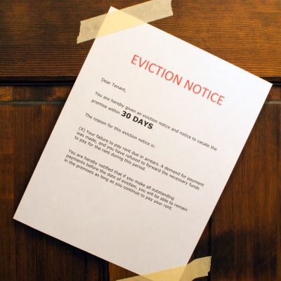Eviction notice taped to a front door.