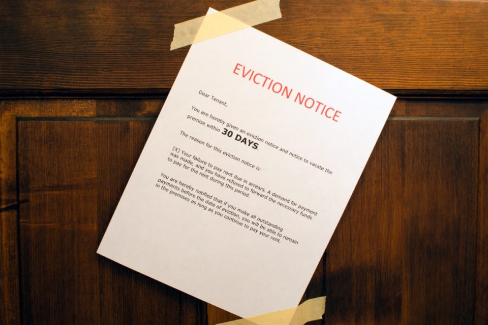 Eviction notice taped to a front door.