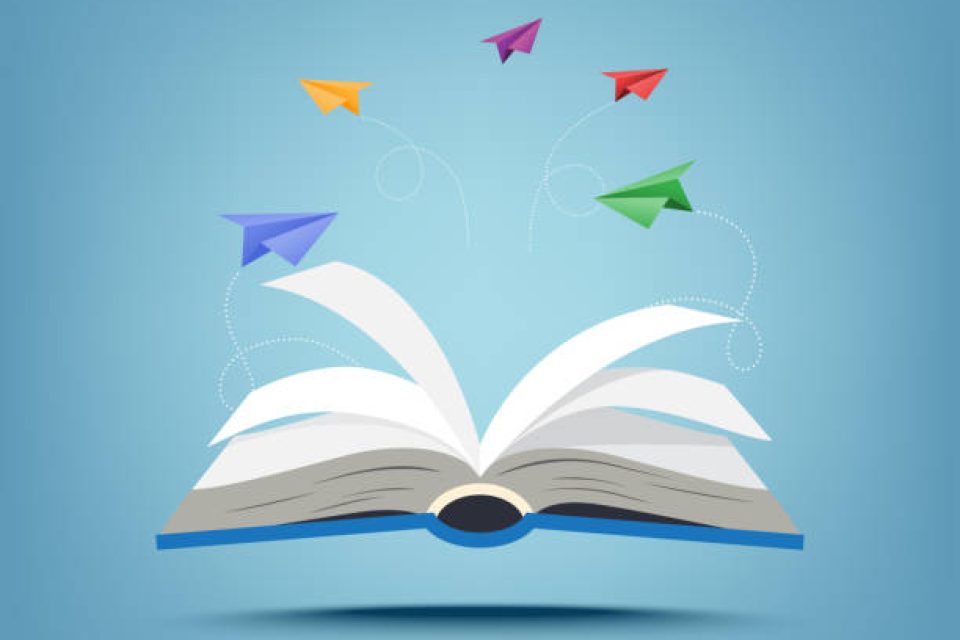 Open book with paper airplanes flying on their own path