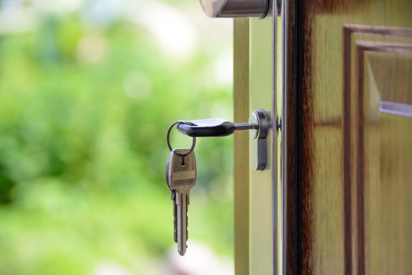 door key sticking out of the front door, symbolizing your right to enjoy your home