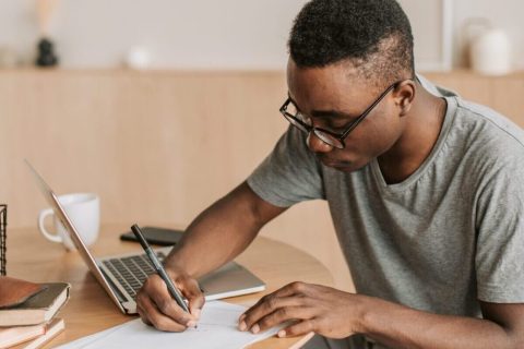 pexels-vlada-karpovich-4939667-scaled-e1612778622313 black college student with lap top applying for internship